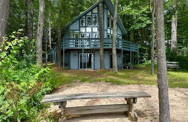 Cozy beachfront cottage in the woods with walkout basement and wrap-around porch