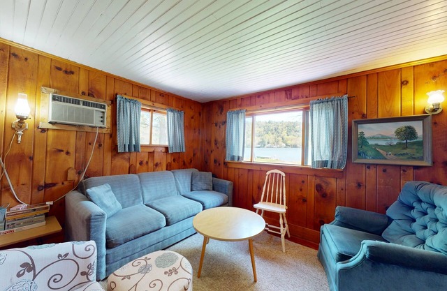 Cozy cottage w/waterfront, beach, dock, lake views, playground, kayaks, and A/C