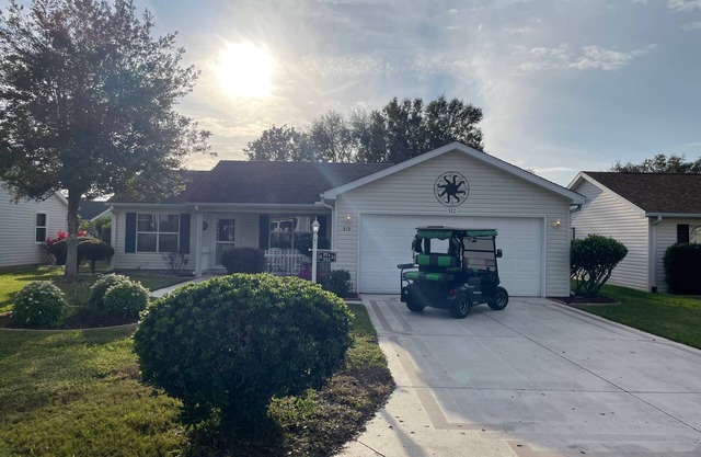 Cozy home w/golf cart, lanai, smart TVs, & prime location near town squares!