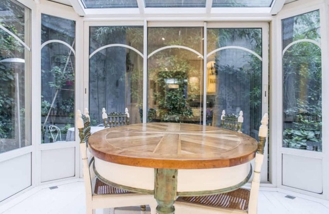 Cozy Parisian style apartment with a veranda overlooking a private garden.