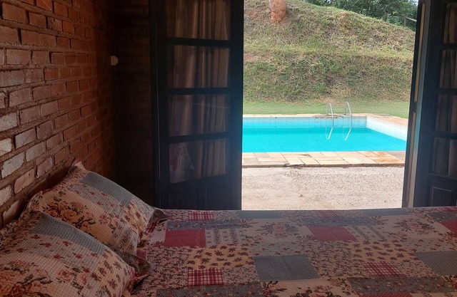 Cozy suite with relaxing pool view surrounded by nature