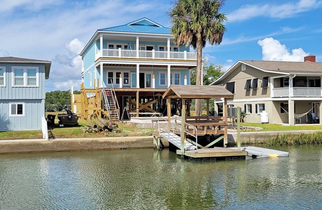 Creek front beach house, elevator, saltwater pool, canal dock, dog friendly
