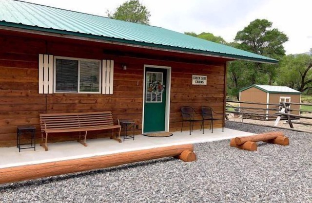 Creek Side Cabin #1 in the Wapiti Valley and steps from Trout Creek