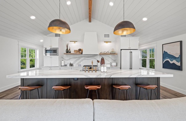 Custom Home with Lake Views + Cozy Fireplace