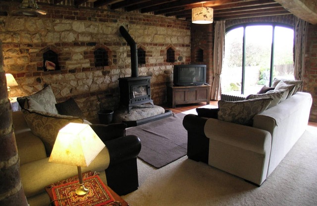 Deceptively spacious and cosy cottage with enclosed gardens and hot tub.