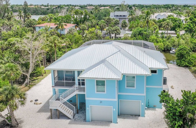 DEJA BLUE | Lux Canal-Front Sanibel Home with Saltwater Pool and View