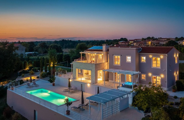 Design Villa Aqua * with 48m² pool, golf court, fitness & spa house