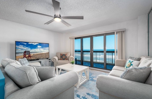 Direct oceanfront corner with private balcony, heated beachfront pool and garage parking