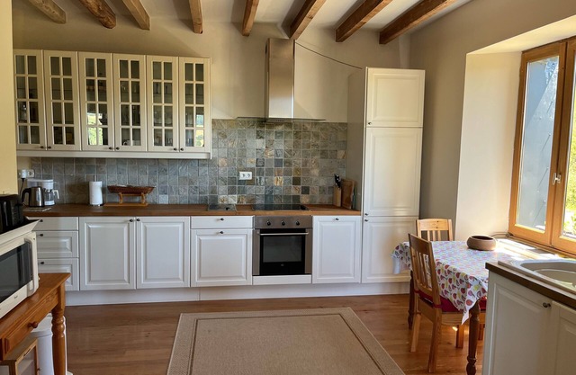 Distinctive farmhouse on a hillside with panoramic views over volcanic landscape