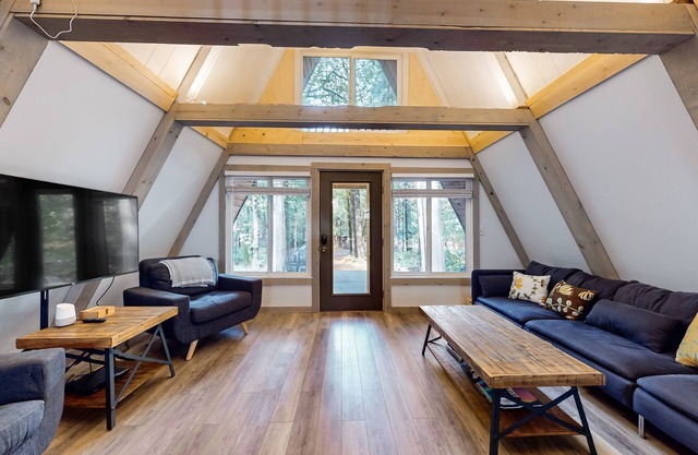Dog-friendly A-frame near the river with game room, firepit, wood stove, & grill