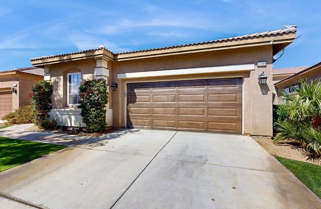 Dog-friendly golf course-adjacent home with a private pool, pool spa, & AC