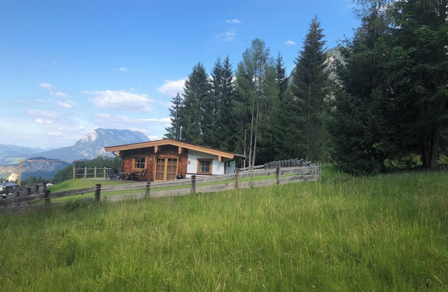 Dreamlike mountain hut with large garden