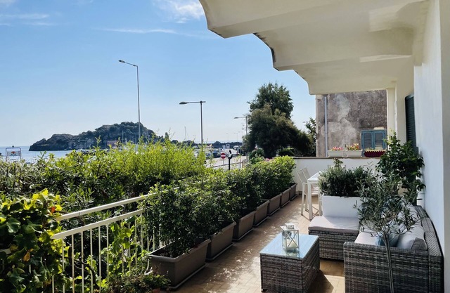Elegant and bright apartment with terrace on the waterfront of Aci Trezza