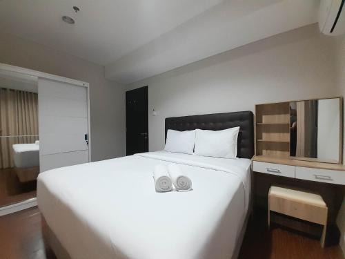 Elegant and Spacious 1BR at Patraland Amarta Apartment By Travelio