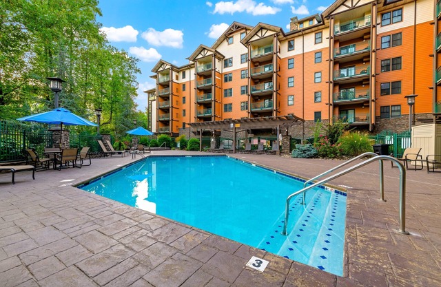 Elegant pool-view condo with free attraction tickets, balcony, & hot tub/pool