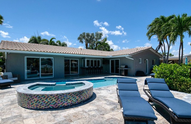 Enchanting waterfront home with pool, hot tub, playground, fast WiFi, & W/D