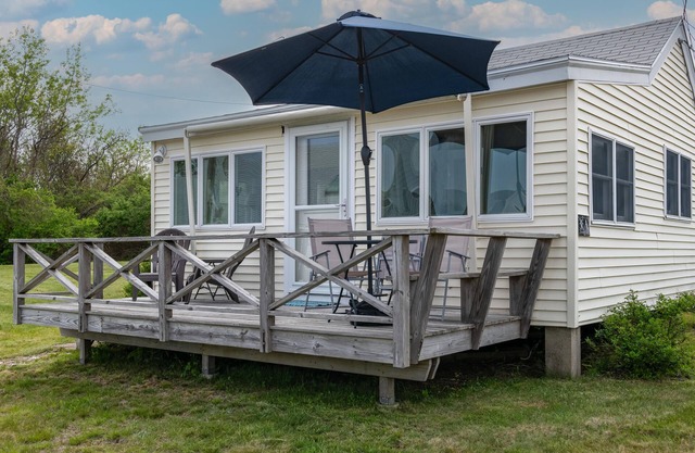 Enjoy beautiful easterly views of Casco Bay from this charming 1BR cottage