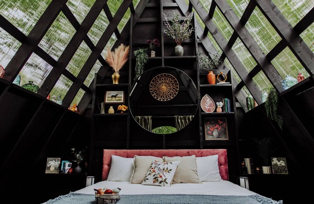 Enjoy the simplicity and elegance of a cozy bedroom in the woods.