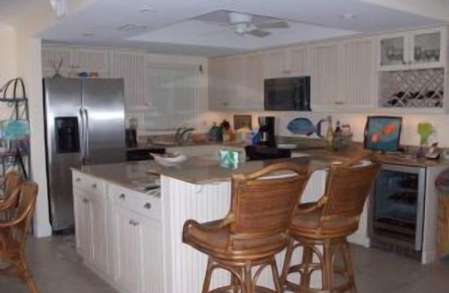 Exclusive third floor three bedroom three bath end condo!