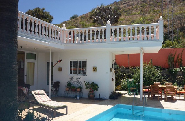 Exotic oasis of peace and relaxation in the palm garden with pool