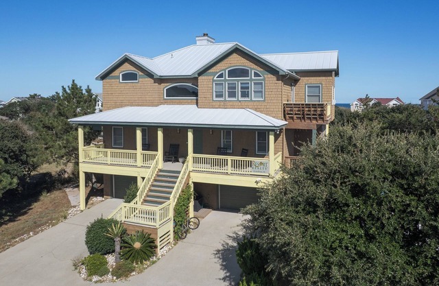 Experience ocean views at Sunshine Stars, a 5-bed, 4.5-bath Corolla home ideal for family getaways.