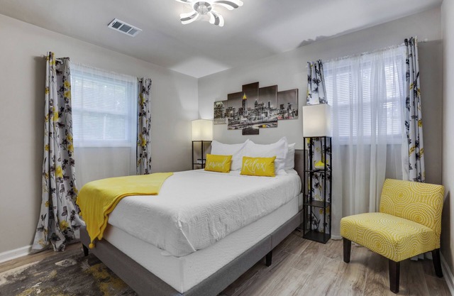 Family-Friendly near Airport, Screened Deck, Backyard Oasis, Workspace & Parking