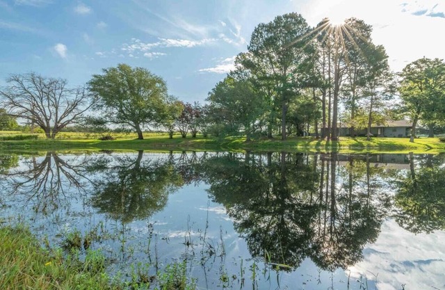 Farmhouse with pond at Canton Trade Days entrance