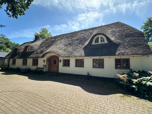 Ferienwohnung im Reetdachhaus Hallerhus