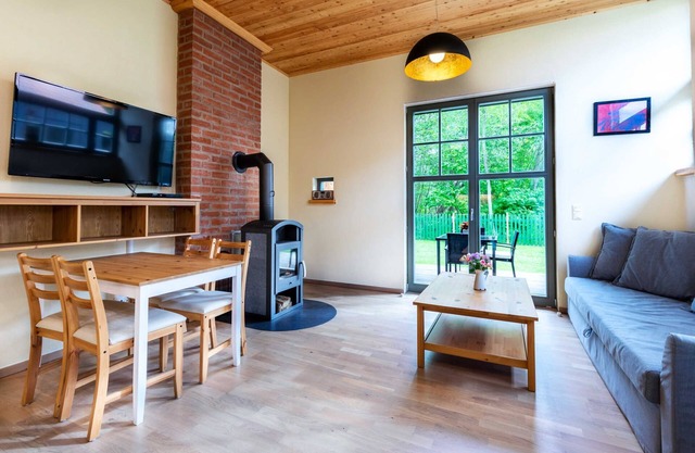 Ferienwohnung Sonne mit Terrasse, Kamin und Garten - Ferienhaus Sonne, Mond und Sterne bei
