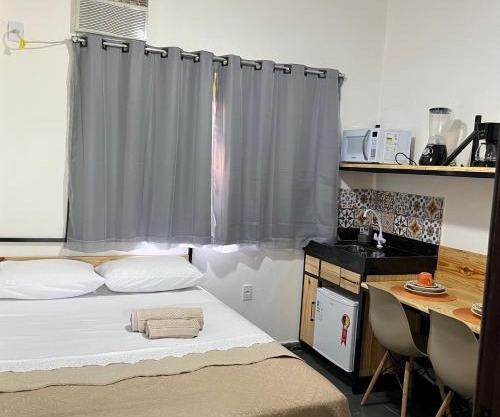 Flat com ar e varanda com linda vista para o Ibituruna - Vôo Livre 203