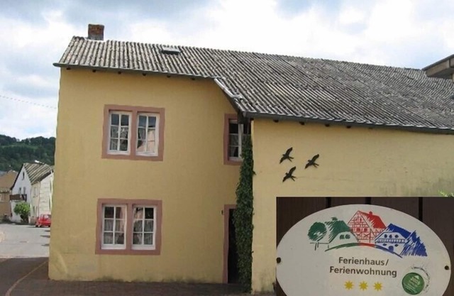 Former farm with a rebuilt barn and courtyard