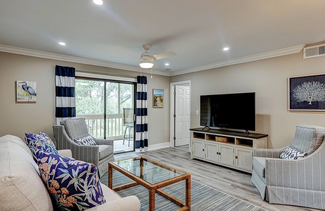 Fully updated condo with serene view, enclosed balcony, WiFi, W/D, pool, & gym