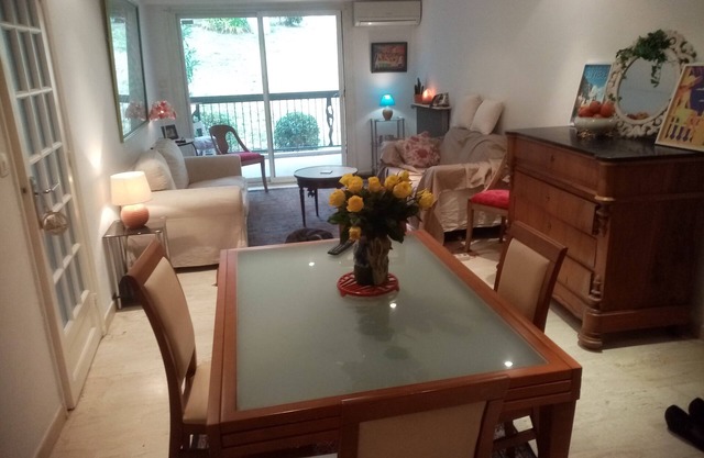 Garden-level apartment in attractive, secure residence with swimming pool.