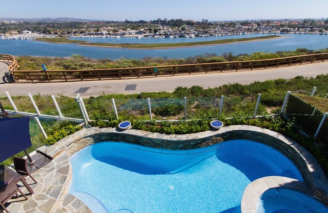 Gated View Home With All Tile Salt Water Pool