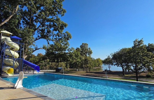 Giant 10-bedroom lakefront home with large pool, hot tub, and dock