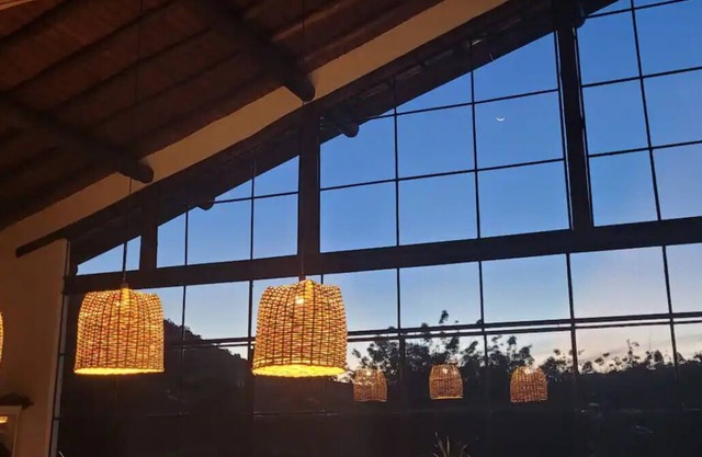 Glass house surrounded by nature