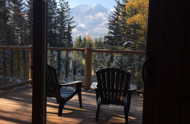 Golden Log House above the Valley