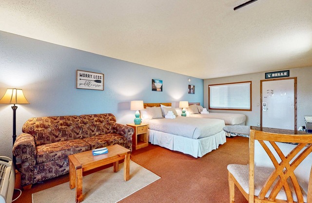 Golf-adjacent condo with balcony, arcade, & playground