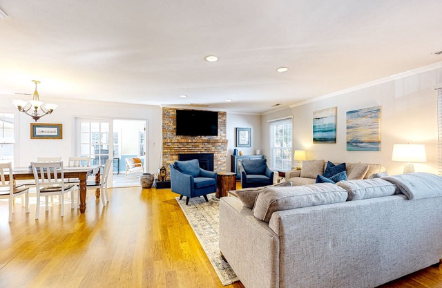 Gorgeous home with an enclosed yard, grill, fireplace, chef's kitchen, AC, & W/D