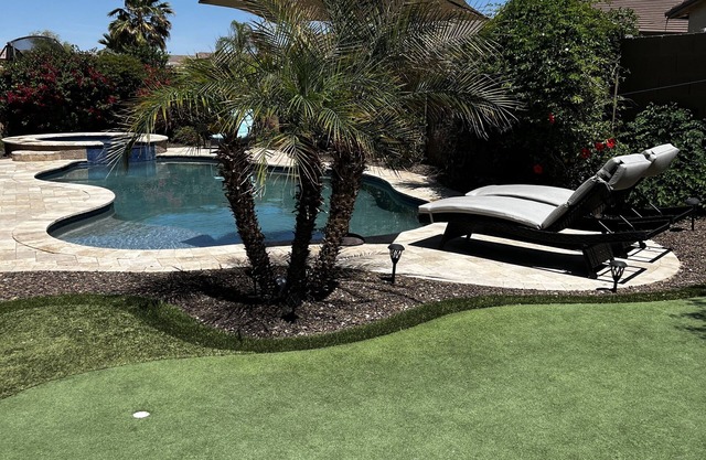 Great family friendly home very private back yard, heated pool & covered patio.