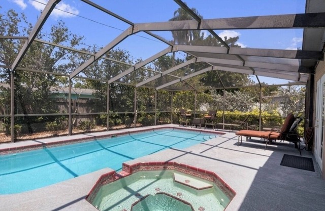 Great Location w/Heated Pool with beautiful outdoor patio/bar area!