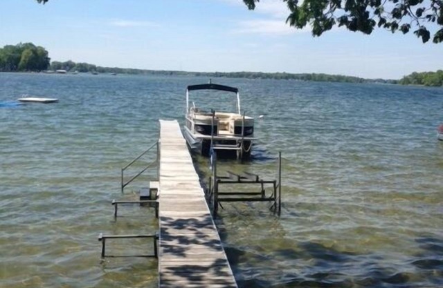 Gun Lake 5-STAR PROPERTY sandy front with full dock and mooring bouy