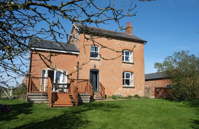 Historic cottage with a large scenic garden, located on a working farm
