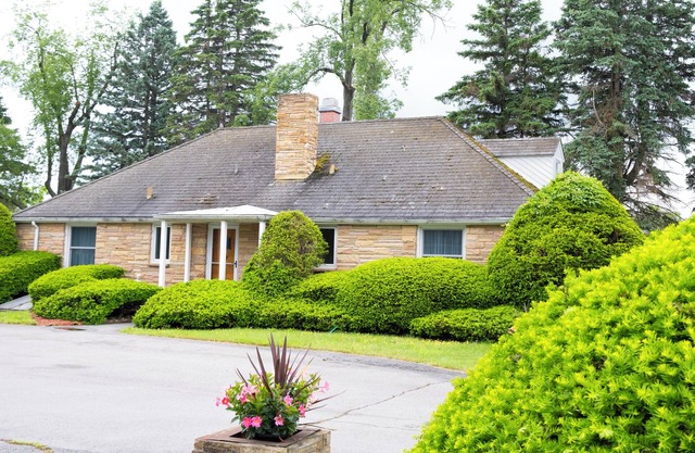 Historic Gate Lodge lovingly renovated and fully furnished in quaint Akron