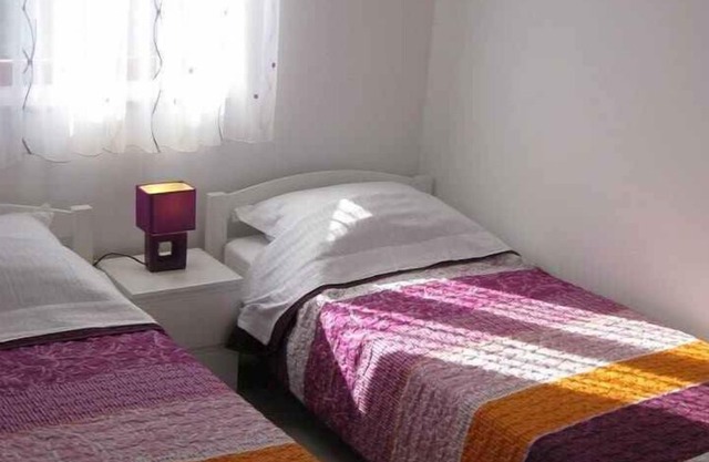 Holiday apartment with air conditioning and balcony near the beach