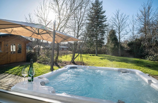 Holiday Home 'Wellness Oasis with Whirlpool and Sauna' with Private Terrace, Garden and Wi-Fi