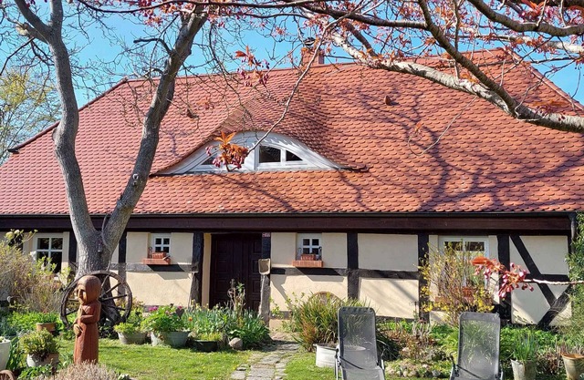 Holiday home with fireplace, patio and a view of nature