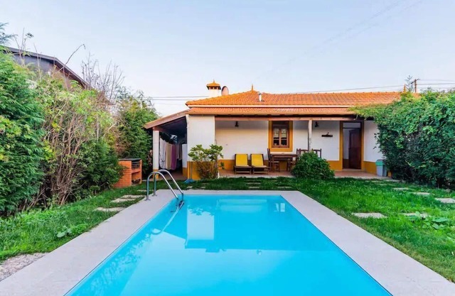 Holiday home with garden, grill, and terrace