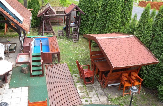 Holiday home with pool, children's swing and slide