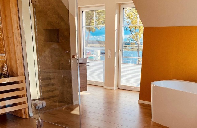 Holiday home with sauna, fireplace and water view